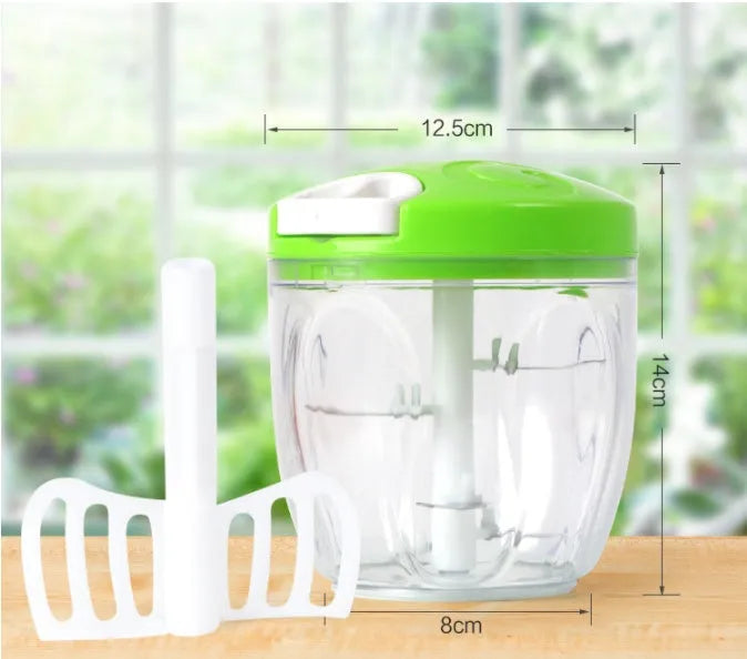 Green manual kitchen chopper with stainless steel blades and a 500ml plastic container.