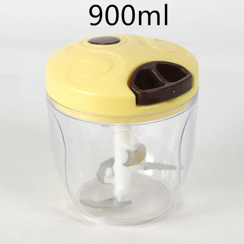 Green manual kitchen chopper with stainless steel blades and a 500ml plastic container.