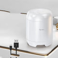 Black or white portable Bluetooth speaker with card reader slot measuring 90x73x73mm with USB charging port