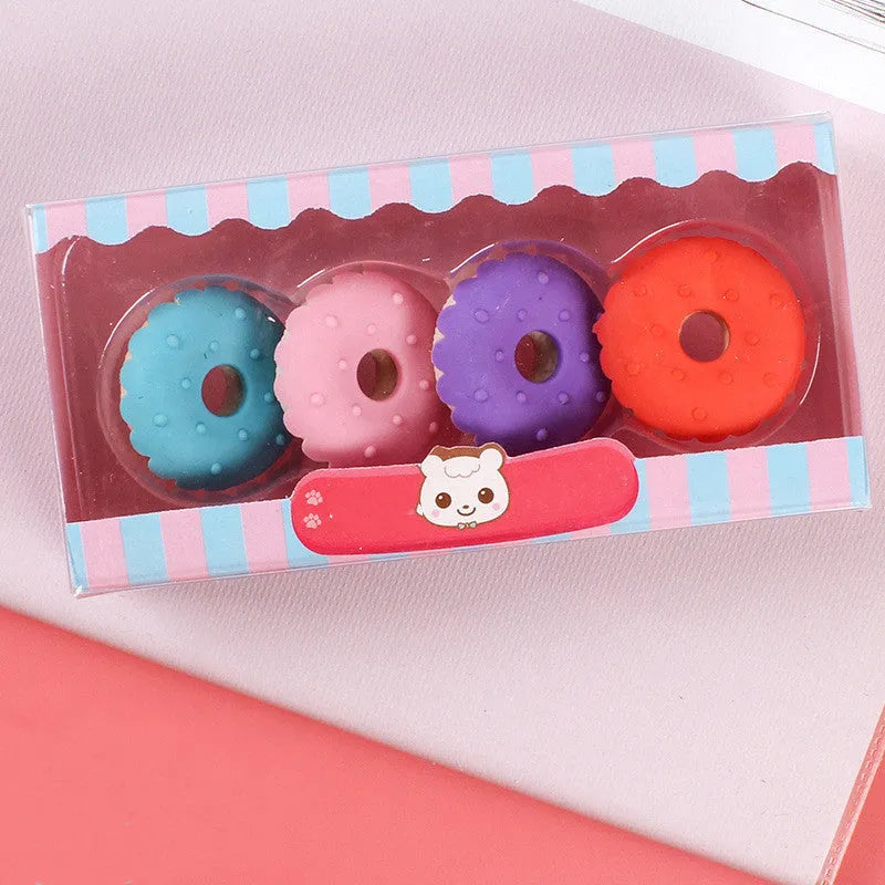 Set of 12 colourful cartoon erasers shaped like ice creams, doughnuts, and lollipops for children.