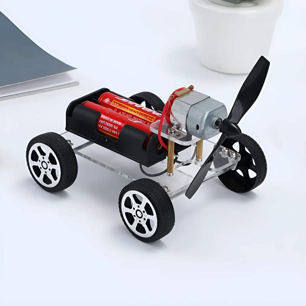 DIY wind car electronic experiment kit with acrylic, metal and plastic parts for children's science education.