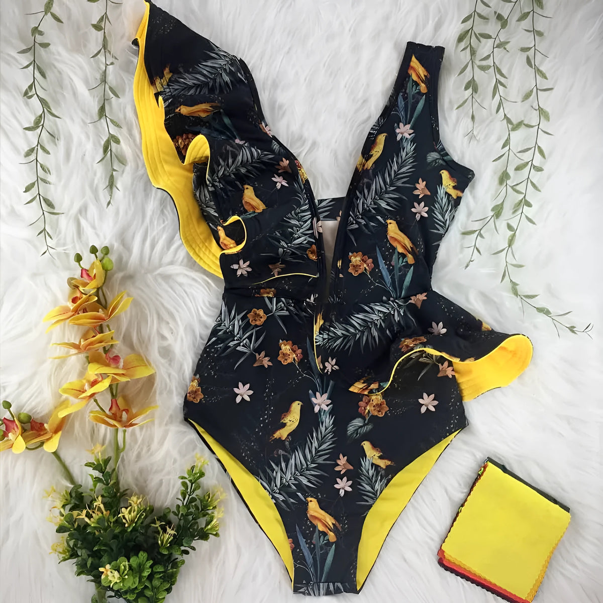 Blue printed one-piece swimsuit for women with one-shoulder ruffle and chest pad on white background