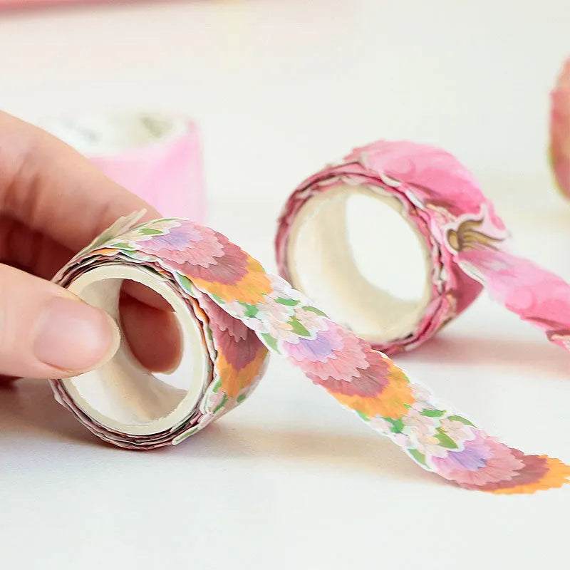 Roll of clover and paper decorative tape for hand book stickers showing colour options