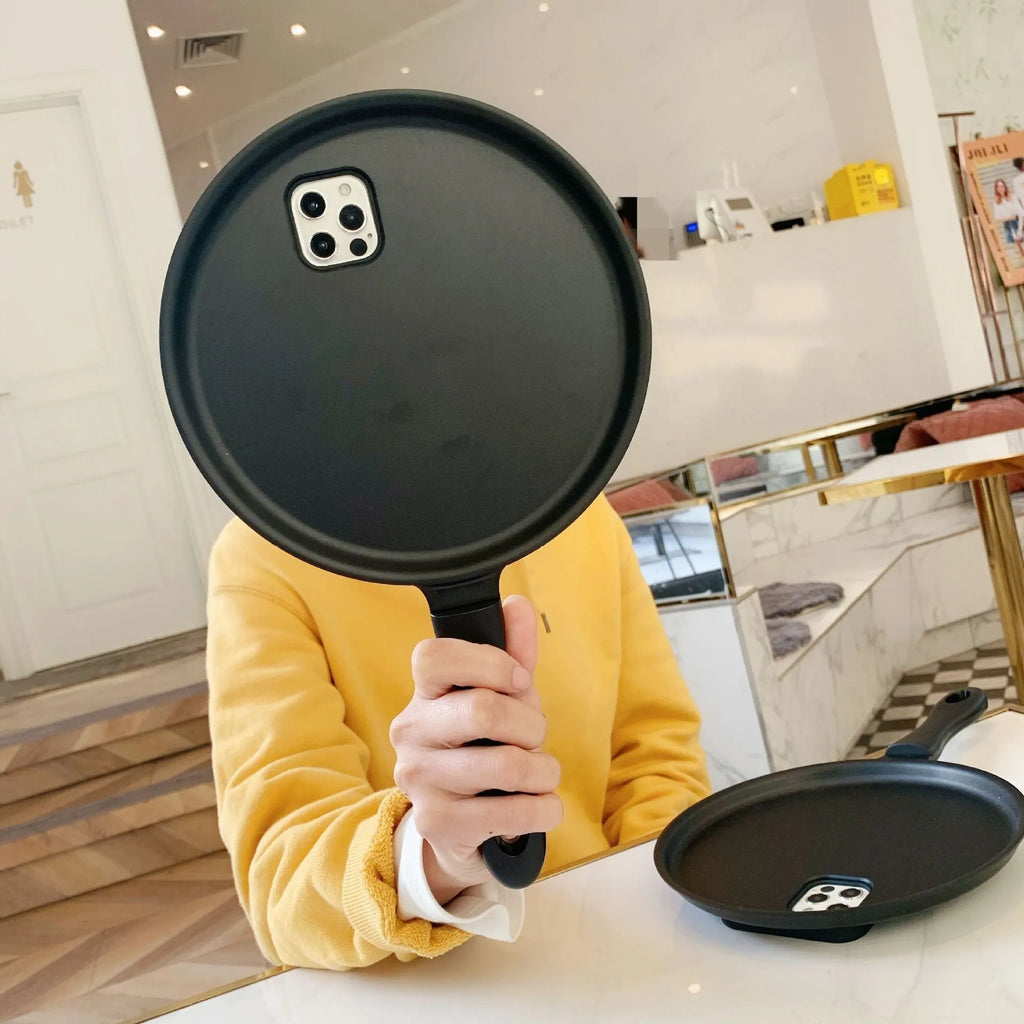 Black 3D frying pan shape iPhone case made of soft TPU and PC, back cover design.
