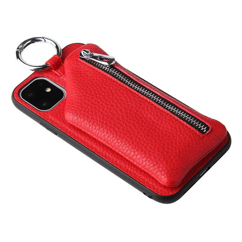 Pink imitation leather crossbody phone case with attached lanyard and zipped coin purse.