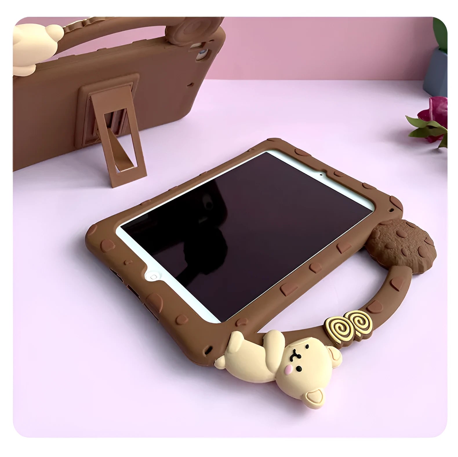 Brown cartoon silicone sleeve with stand bracket on the back, fitted on an iPad tablet.