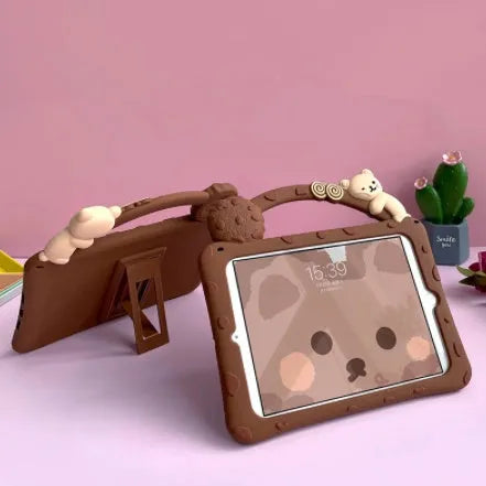 Brown cartoon silicone sleeve with stand bracket on the back, fitted on an iPad tablet.