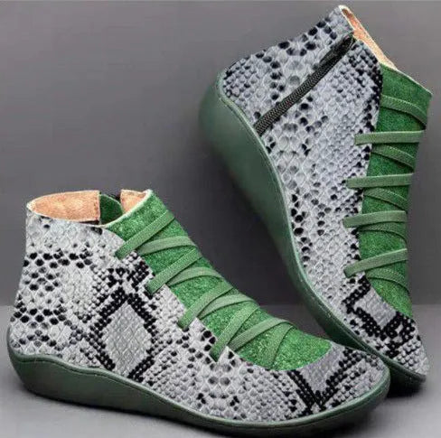 Women's casual flat ankle boots in artificial PU leather with a round toe and wedge rubber sole.