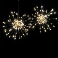 LED Meteor Shower or solar firework decoration light with multiple warm white LEDs, shown outdoors in a garden setting.