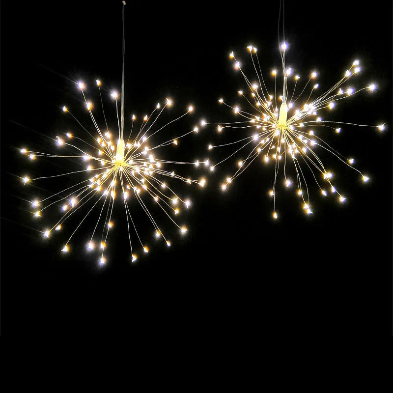 LED Meteor Shower or solar firework decoration light with multiple warm white LEDs, shown outdoors in a garden setting.