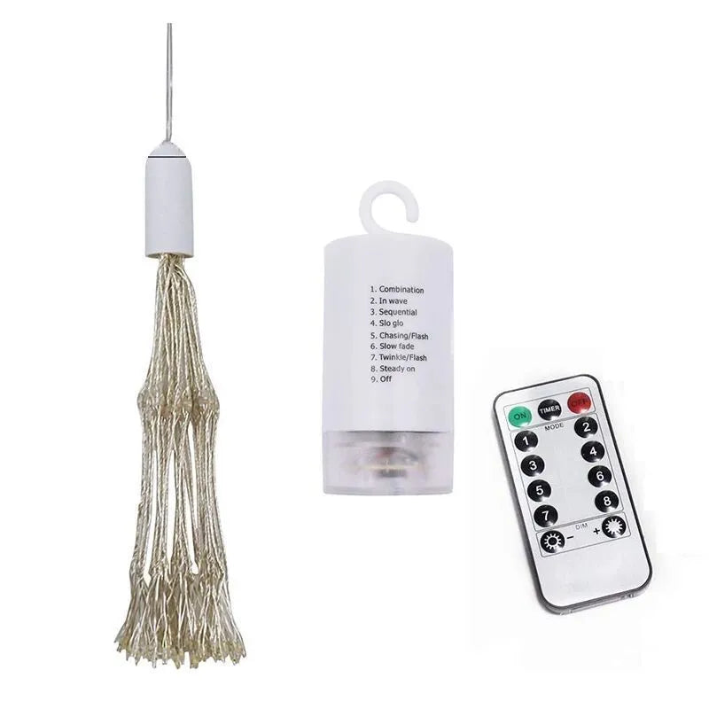 LED Meteor Shower or solar firework decoration light with multiple warm white LEDs, shown outdoors in a garden setting.