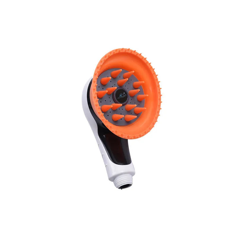 Pet shower kit with integrated massage brush for dogs and cats in orange colour on light background