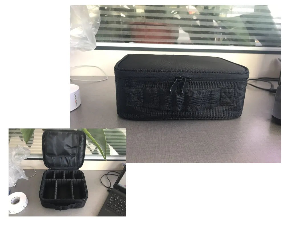 Mini black nylon cosmetic bag with zip closure, 26x22x12cm, shown open with make-up inside