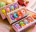 Set of 12 colourful cartoon erasers shaped like ice creams, doughnuts, and lollipops for children.