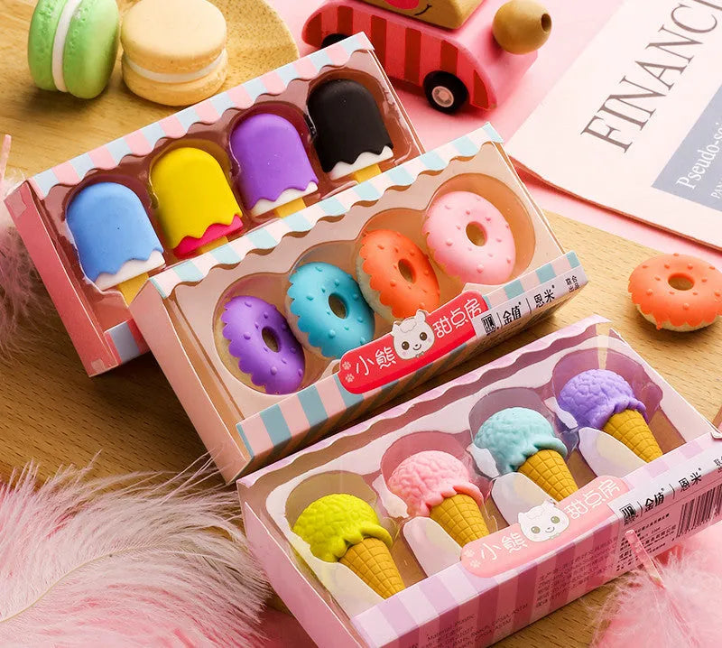 Set of 12 cartoon-shaped erasers including cones, ice creams, donuts, and lollipops for children.