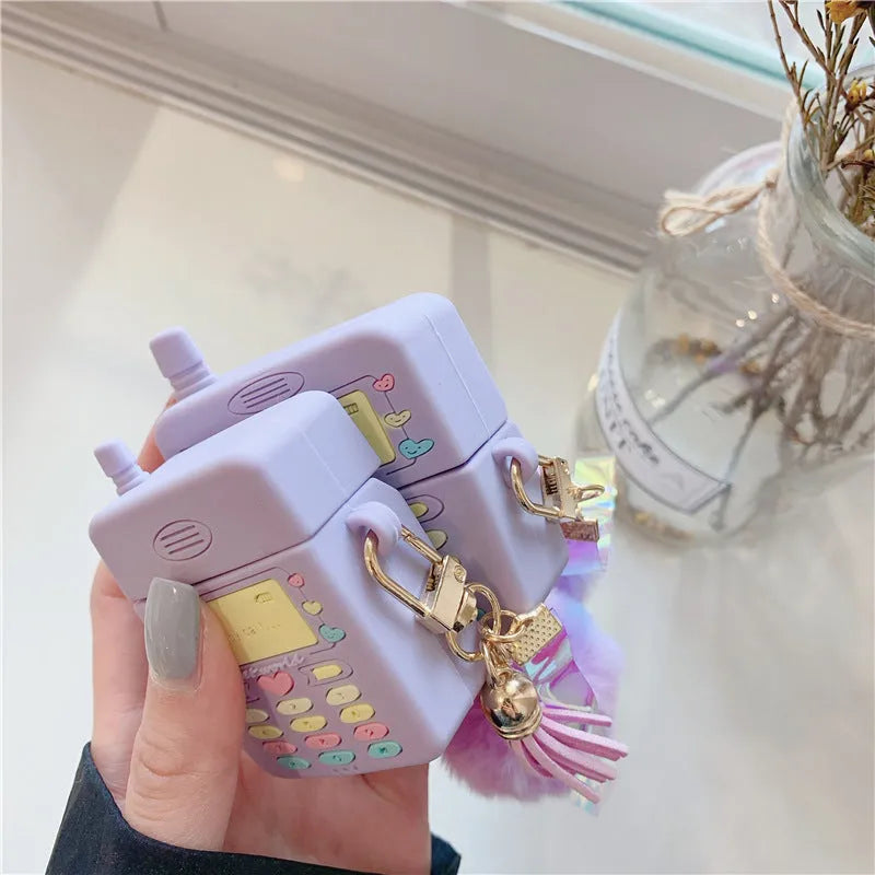 Purple silicone clamshell case with fur ball pendant for Apple AirPods wireless earphones
