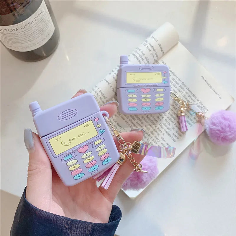 Purple silicone clamshell case with fur ball pendant for Apple AirPods wireless earphones