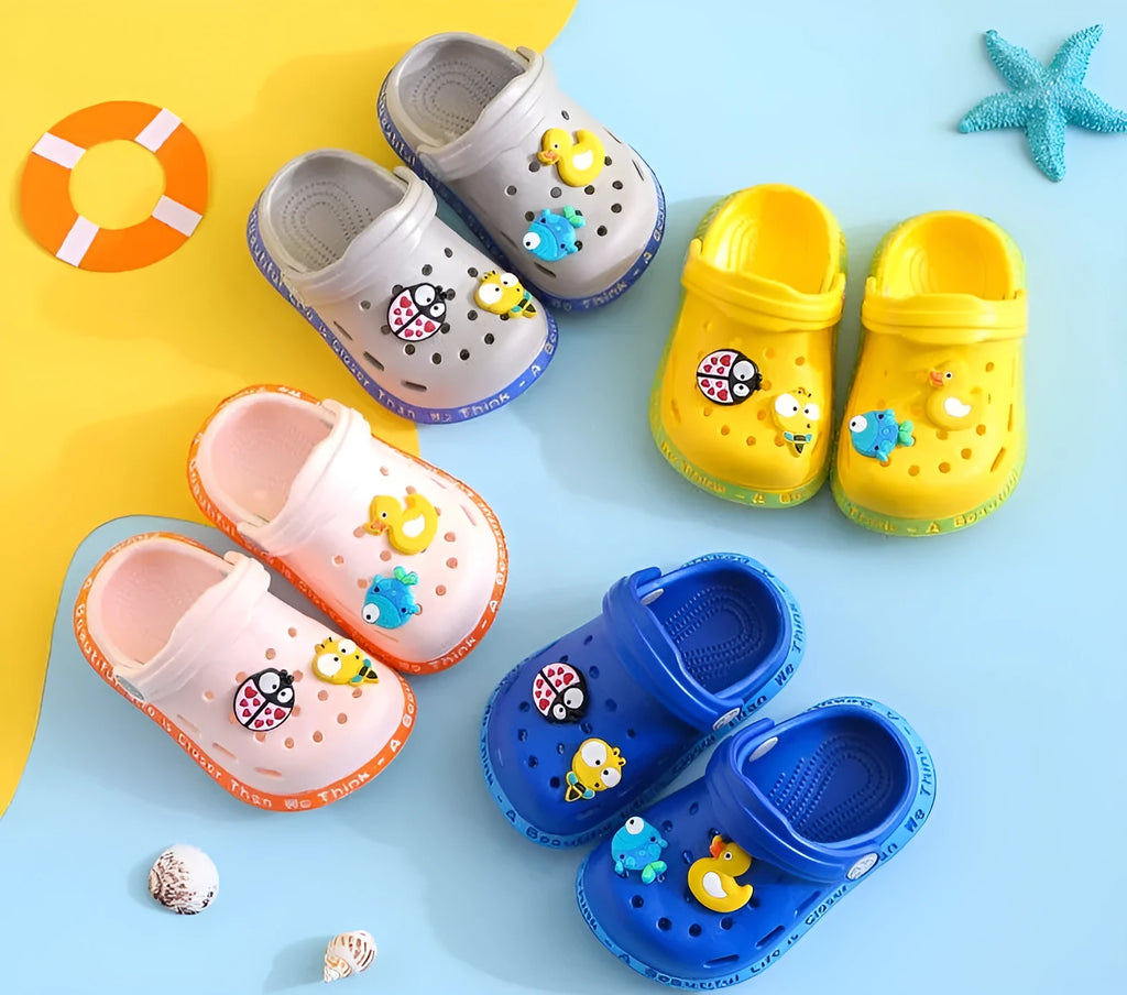 Children's PVC slippers with cartoon animal patterns in yellow, blue and pink colours