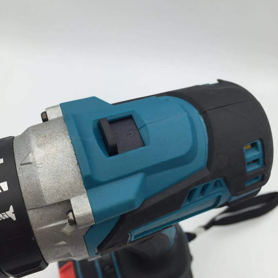 Black and yellow cordless impact drill with keyless chuck, shown with a lithium-ion battery and drill bit.