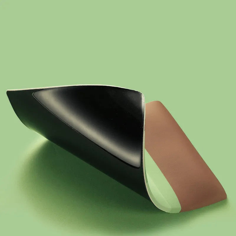 Green kiwi fruit design on a grey cloth mouse pad with a thick, curved wrist support cushion