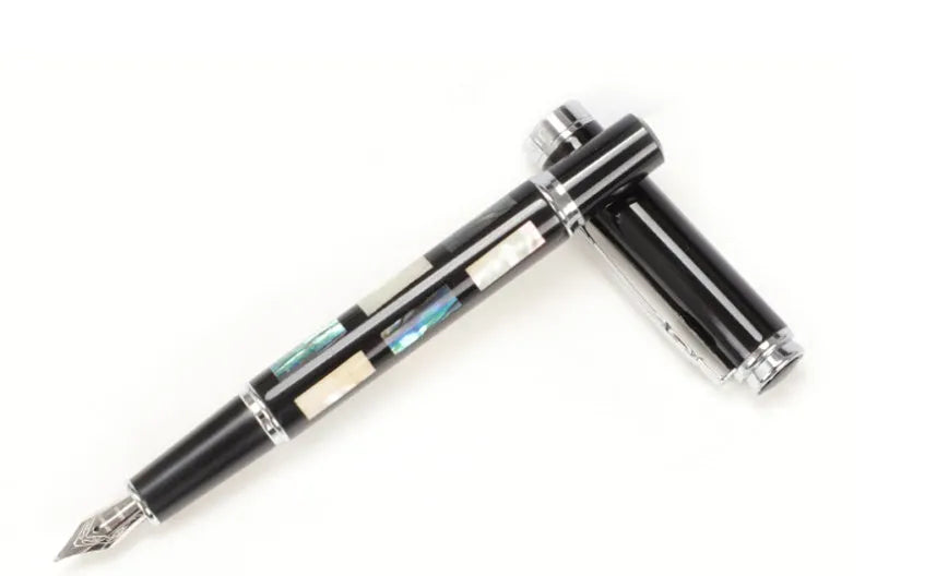 Ceramic colour lacquer pen with rotating ink system and interchangeable nib options in metal body