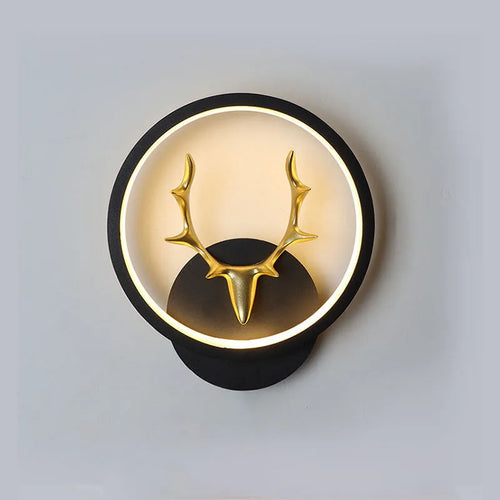 Deer antler shaped wall lamp with remote control on a light coloured wall
