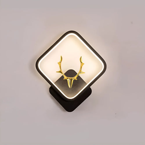 Deer antler shaped wall lamp with remote control on a light coloured wall