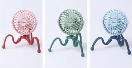 Pink portable USB rechargeable fan with animal design and clip attached to a stroller handle.