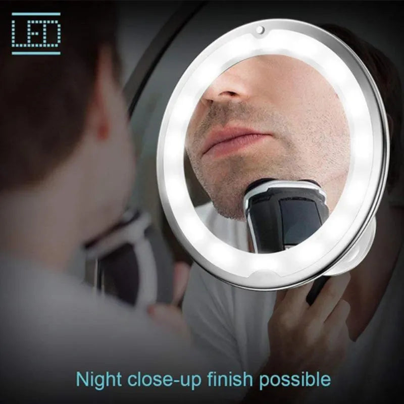 White 10x magnifying LED makeup mirror with gooseneck and suction base on a countertop
