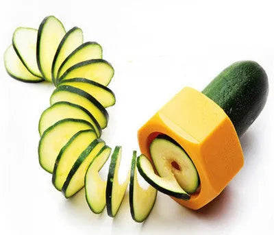 Yellow and green plastic spiral vegetable cutter on a kitchen worktop.