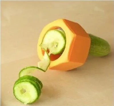 Yellow and green plastic spiral vegetable cutter on a kitchen worktop.