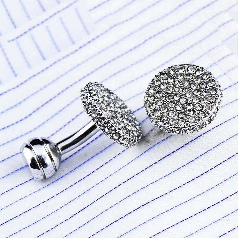 Pair of round 18mm crystal full rhinestone cufflinks with button with feet fastening on white background