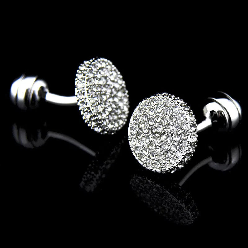 Pair of round 18mm crystal full rhinestone cufflinks with button with feet fastening on white background