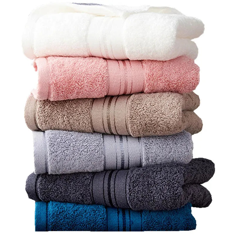 Three-piece thick cotton towel set showing bath towel, hand towel, and square scarf in a solid blue colour.