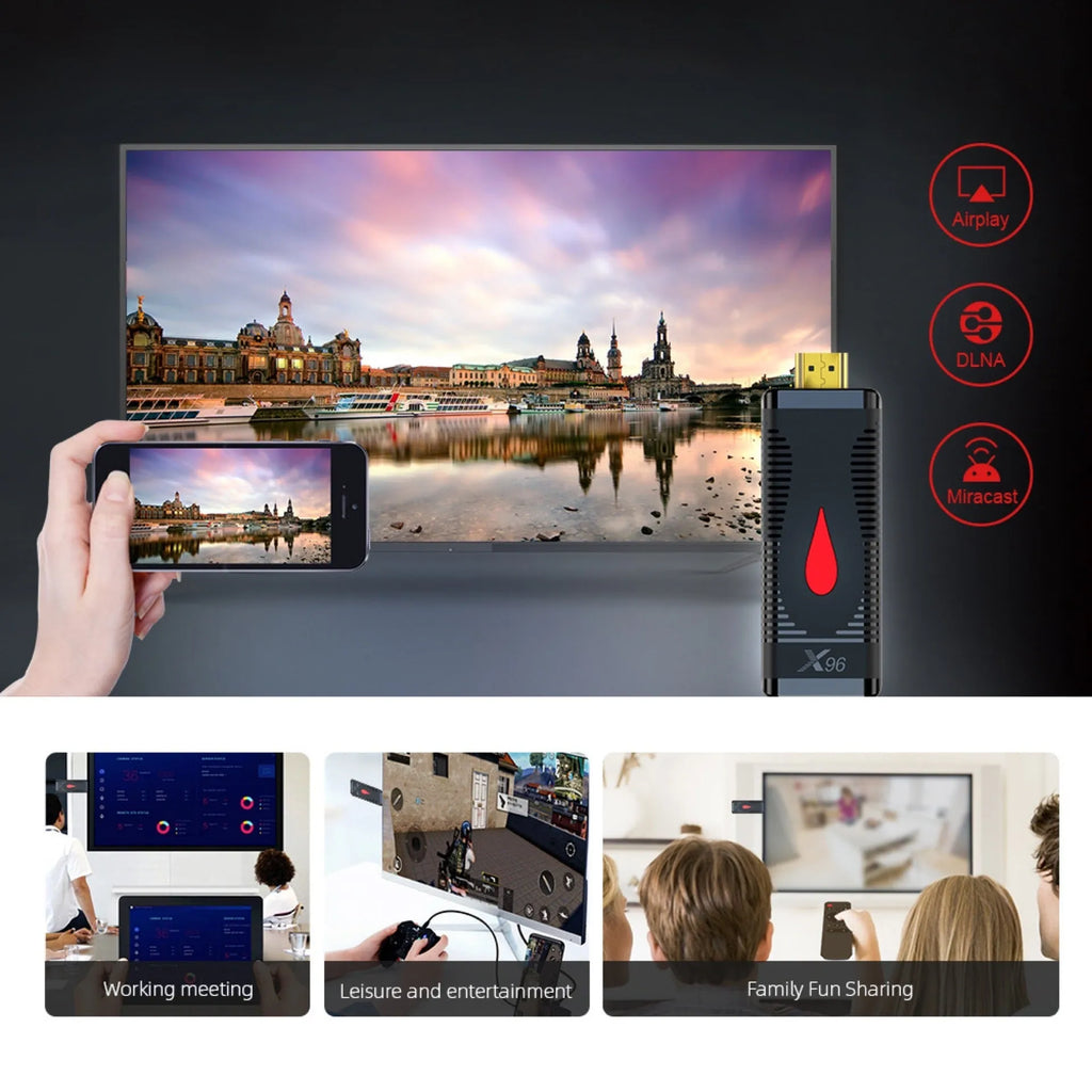 Compact black smart TV set-top box dongle with remote control, HDMI cable, and power adapter on a wooden table.