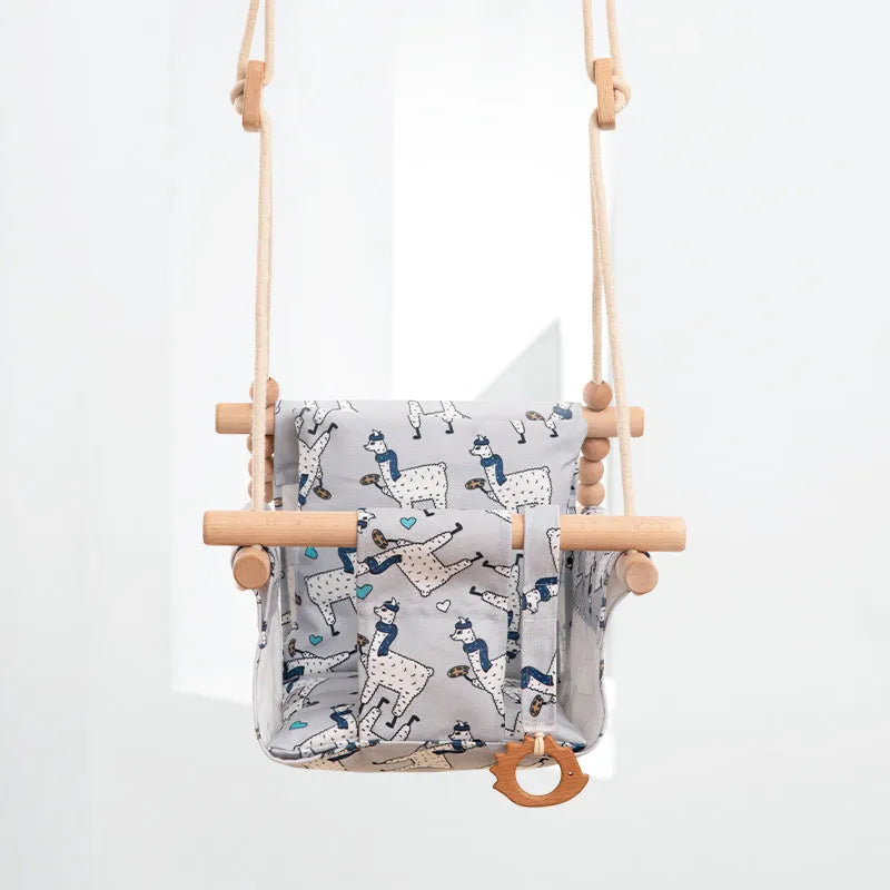Natural cotton canvas baby swing chair with wooden seat and cushion hanging indoors
