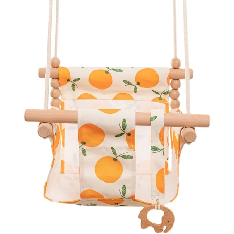 Natural cotton canvas baby swing chair with wooden seat and cushion hanging indoors