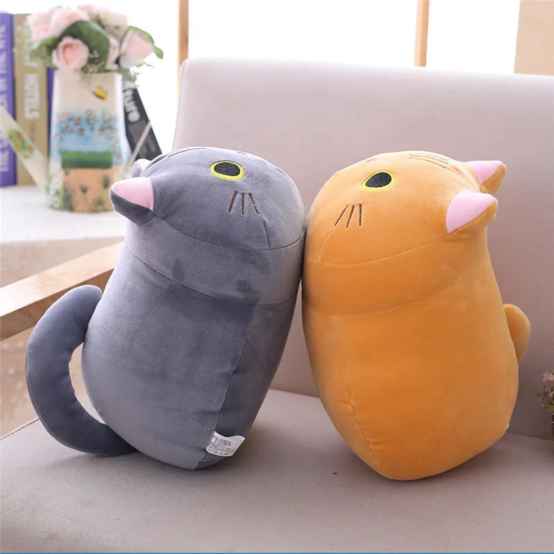 Soft grey fat cat plush doll filled with down cotton on a white background.