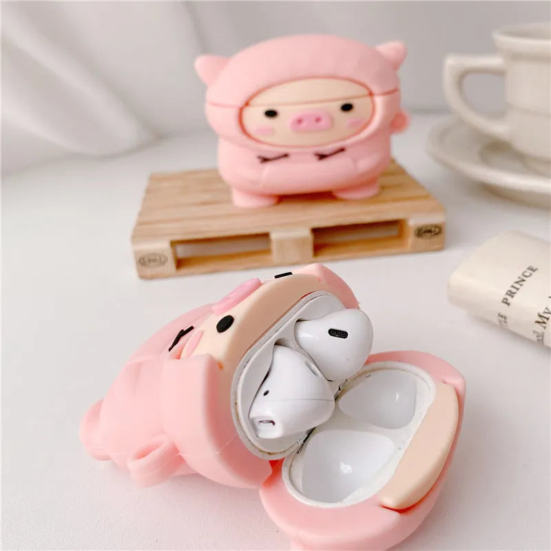 Silicone AirPods case with flip cover showing cartoon pink pig design compatible with Apple wireless headphones