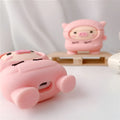 Silicone AirPods case with flip cover showing cartoon pink pig design compatible with Apple wireless headphones