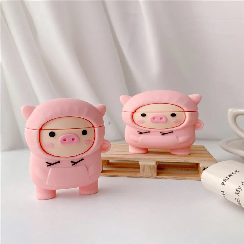 Silicone AirPods case with flip cover showing cartoon pink pig design compatible with Apple wireless headphones