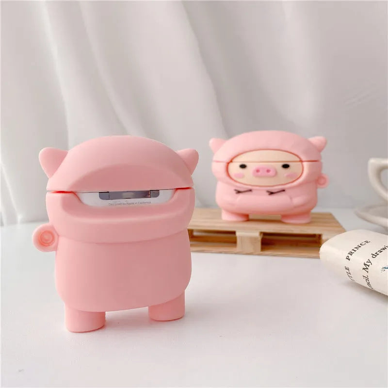 Silicone AirPods case with flip cover showing cartoon pink pig design compatible with Apple wireless headphones
