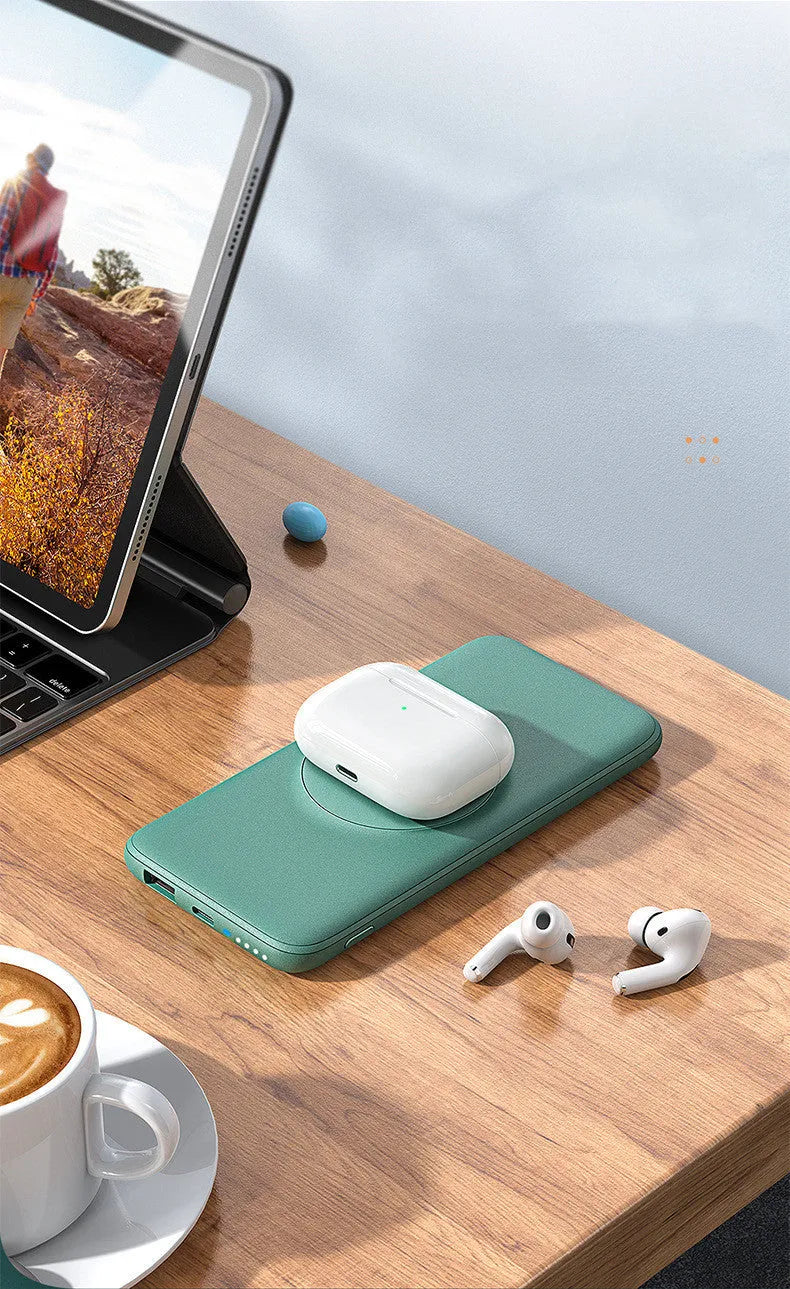 Mint green Maiduo MagSafe power bank with back clip attached to an iPhone, showing magnetic wireless charging.