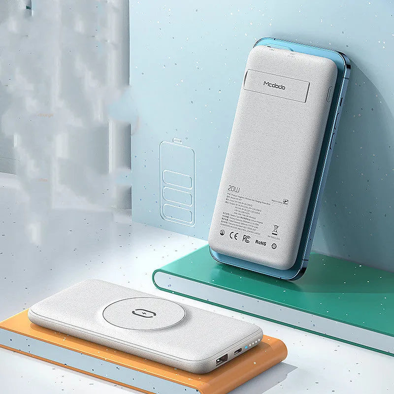 Mint green Maiduo MagSafe power bank with back clip attached to an iPhone, showing magnetic wireless charging.