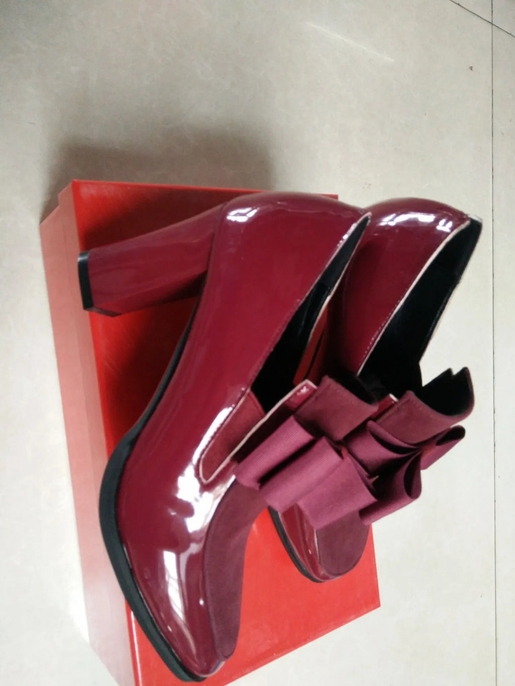 Black and wine red women's leather high heels with a thick square heel and square toe.