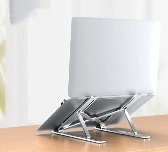 Aluminium alloy folding laptop heightening bracket in black on a desk with a notebook