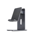 Dark Space Grey aluminium alloy mobile phone holder with adjustable lazy bracket arm and clamp on a wooden desk.
