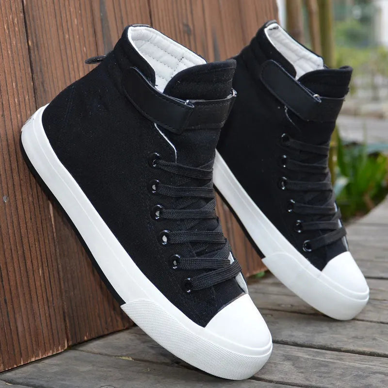 Velcro student canvas shoes high top with canvas upper, rubber vulcanised sole, round toe, and flat heel in black, grey or red and white.