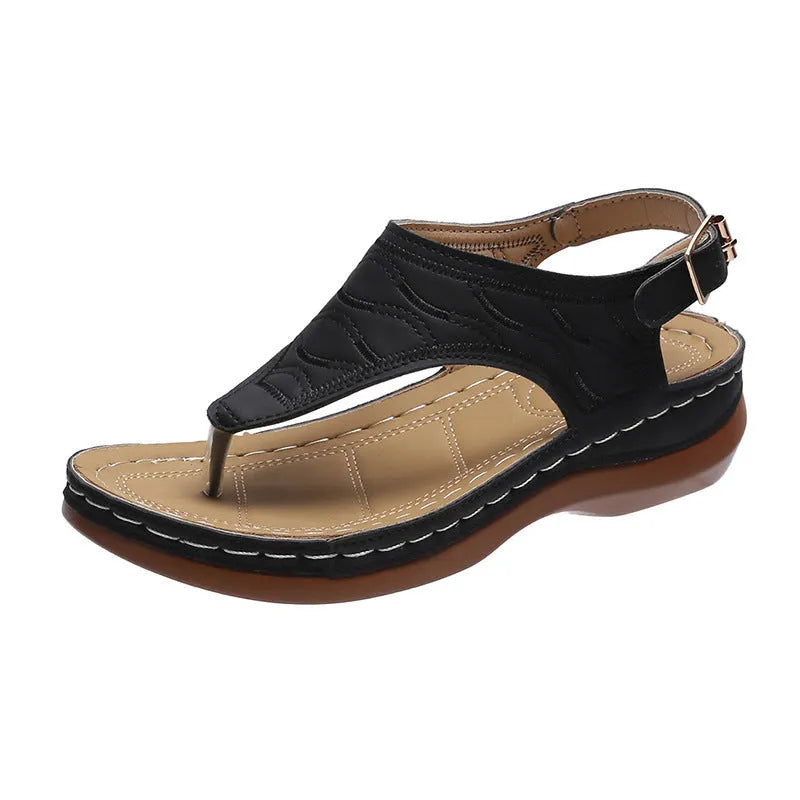 Women's black casual wedge heel sandals with an adjustable buckle strap on ankle.