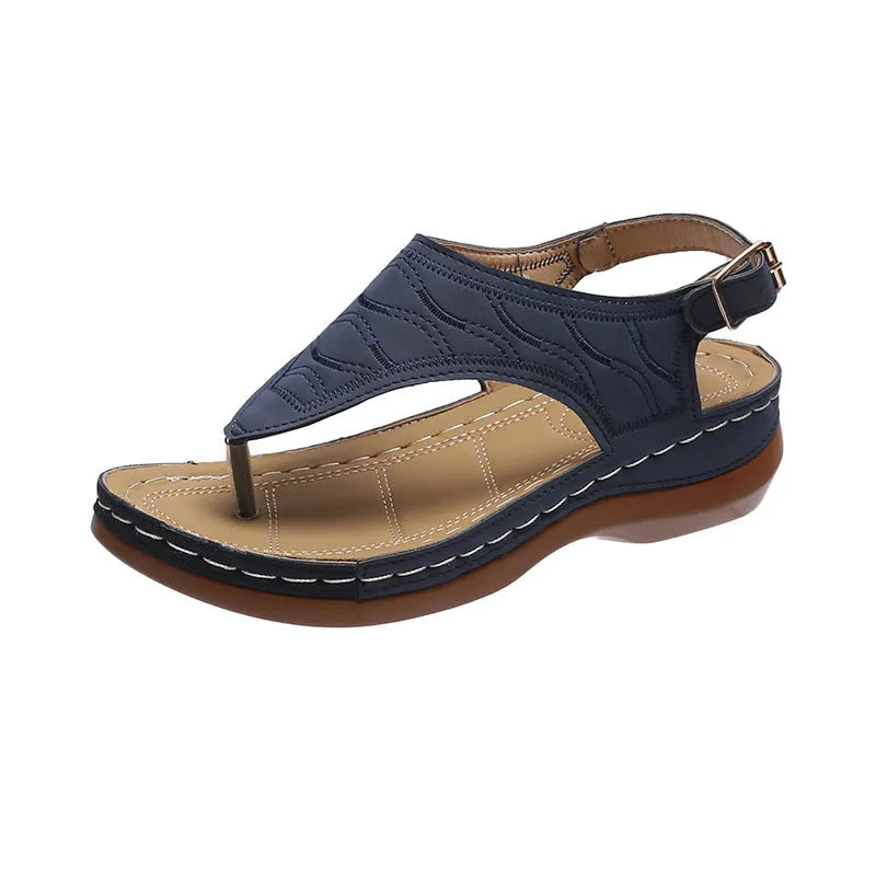 Women's black casual wedge heel sandals with an adjustable buckle strap on ankle.